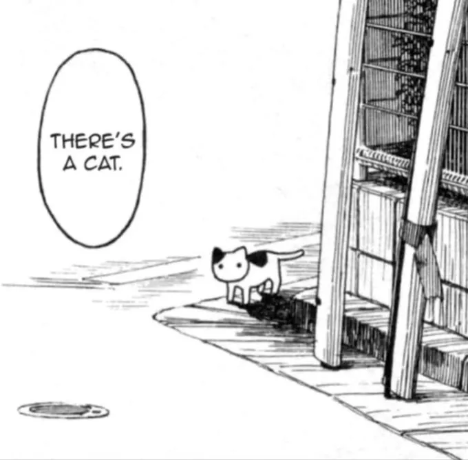 single comic panel showing a simplified cat drawing on the corner of a street, and a text buble saying «there's a cat.»